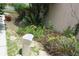 This home's garden space includes stones and plants at 386 San Jose Dr, Winter Haven, FL 33884