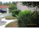 This property boasts lush landscaping and features a charming concrete block fence at 386 San Jose Dr, Winter Haven, FL 33884