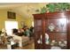 Cozy living room with hardwood floors, display case and furniture arrangement, perfect for entertaining at 386 San Jose Dr, Winter Haven, FL 33884