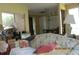 Comfortable living room with floral sofa, a side window bringing soft natural light to the space at 386 San Jose Dr, Winter Haven, FL 33884