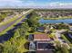 A scenic neighborhood showcases homes with screened pools, near both a lake and a highway, offering convenience and recreation at 421 Bailey Cir, Davenport, FL 33897