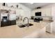 Modern kitchen featuring stainless steel appliances, white cabinetry, and a center island at 421 Bailey Cir, Davenport, FL 33897