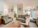 Open-concept living room and dining area with neutral tones, tile floors and lots of natural light at 421 Bailey Cir, Davenport, FL 33897