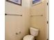 Clean powder room with a toilet, towel bars, and neutral wall color at 421 Bailey Cir, Davenport, FL 33897