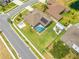 An aerial view of a meticulously landscaped home with a private, screened-in pool and a spacious, fenced backyard at 4301 Mohawk Ct, St Cloud, FL 34772