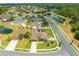 A lovely aerial view showcases the home's pool, landscaping, and proximity to a serene pond at 4301 Mohawk Ct, St Cloud, FL 34772