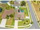 Beautiful home from above, featuring a screened pool, landscaped yard, and charming curb appeal on a sunny day at 4301 Mohawk Ct, St Cloud, FL 34772