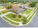 Beautiful home with a well-manicured lawn, fenced-in backyard, screened pool, and solar panels on the roof at 4301 Mohawk Ct, St Cloud, FL 34772