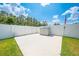 A spacious backyard featuring a white vinyl fence and outdoor storage at 4301 Mohawk Ct, St Cloud, FL 34772
