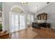 Open entryway with double doors, transom window, and adjacent formal dining area at 4301 Mohawk Ct, St Cloud, FL 34772