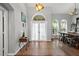 Open foyer featuring tile floors, tall ceilings, and natural light streaming through the arched windows at 4301 Mohawk Ct, St Cloud, FL 34772