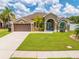 Inviting single Gathering home with a well-manicured lawn, two-car garage, and a covered front entry at 4301 Mohawk Ct, St Cloud, FL 34772
