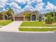 Charming single Gathering home featuring a well-maintained lawn, two-car garage, and a covered front entry at 4301 Mohawk Ct, St Cloud, FL 34772