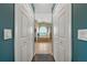 Hallway view of bathroom featuring tub, shower, and double closets at 4301 Mohawk Ct, St Cloud, FL 34772