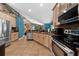 Well-appointed kitchen features stainless appliances, wood cabinets and open floorplan at 4301 Mohawk Ct, St Cloud, FL 34772