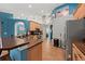 Open kitchen features tile flooring, modern appliances, and light wood cabinets at 4301 Mohawk Ct, St Cloud, FL 34772