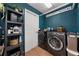 Well-organized laundry room with modern washer and dryer and ample storage at 4301 Mohawk Ct, St Cloud, FL 34772