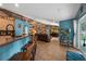 Open floor plan features kitchen bar and spacious living room with media center at 4301 Mohawk Ct, St Cloud, FL 34772