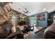 Cozy living room features wood-look accent wall and backyard access at 4301 Mohawk Ct, St Cloud, FL 34772
