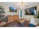Cozy living room featuring modern decor, chandelier, and a decorative rug at 4301 Mohawk Ct, St Cloud, FL 34772