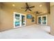 Covered outdoor patio featuring ceiling fans, TV, and view of the pool at 4301 Mohawk Ct, St Cloud, FL 34772