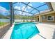 Beautiful screened-in pool with string lights and a spacious patio area at 4301 Mohawk Ct, St Cloud, FL 34772