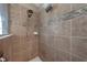 Beautiful tile shower has dual shower heads and decorative border at 4301 Mohawk Ct, St Cloud, FL 34772