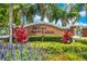 The Indian Lakes community sign framed by colorful landscaping and flowers at 4301 Mohawk Ct, St Cloud, FL 34772