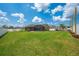 A large, well maintained lawn featuring a shed, outdoor kitchen, and screened in back porch at 4301 Mohawk Ct, St Cloud, FL 34772