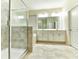 Modern bathroom features dual sinks, tiled shower, and spacious vanity at 4310 Seven Canyons Dr, Kissimmee, FL 34746