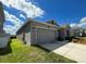 Charming one-story home boasts a two-car garage and manicured lawn at 4310 Seven Canyons Dr, Kissimmee, FL 34746