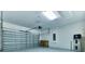 Attached two car garage with garage door, water heater, and mechanical systems at 4310 Seven Canyons Dr, Kissimmee, FL 34746