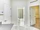 Hallway with tile floor, a nearby bathroom, and a bedroom down the hall at 4310 Seven Canyons Dr, Kissimmee, FL 34746