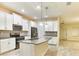 Well-lit kitchen with stainless steel appliances, granite countertops, and a kitchen island at 4310 Seven Canyons Dr, Kissimmee, FL 34746