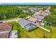 Aerial view of a home with a screened-in pool, patio, deck and well-manicured lawn, offering a private oasis at 4413 Chalfont Dr, Orlando, FL 32837