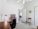 Bright room featuring carpeted floor, ceiling fan and office setup at 4413 Chalfont Dr, Orlando, FL 32837
