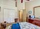 Neutral bedroom with double closets and view of the ensuite bathroom at 4413 Chalfont Dr, Orlando, FL 32837