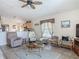 Comfortable living room with view to the open kitchen and bright natural lighting at 4413 Chalfont Dr, Orlando, FL 32837