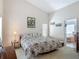 Spacious main bedroom features a vaulted ceiling and ensuite bathroom at 4413 Chalfont Dr, Orlando, FL 32837
