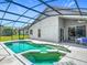 A screened-in pool with clear blue water and a nearby patio set, perfect for relaxing and entertaining by the pool at 4413 Chalfont Dr, Orlando, FL 32837
