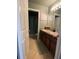 Bathroom with double sinks, tile flooring, and a shower/tub combination at 4714 Greycliff Prairie Dr, Kissimmee, FL 34758