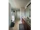 Primary bathroom featuring double sinks, tile flooring, a shower, and a tub at 4714 Greycliff Prairie Dr, Kissimmee, FL 34758