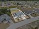 Aerial view of the property and surrounding neighborhood showcasing the home and large backyard at 491 Majestic Gardens Blvd, Winter Haven, FL 33880