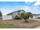 Charming single-story home with a well-maintained lawn, complemented by decorative stone accents and a privacy fence at 491 Majestic Gardens Blvd, Winter Haven, FL 33880
