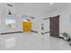 Open living area featuring tile floors, a ceiling fan, and bright yellow doors at 491 Majestic Gardens Blvd, Winter Haven, FL 33880