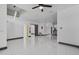Spacious living area with tile flooring, a modern ceiling fan, and lots of natural light at 491 Majestic Gardens Blvd, Winter Haven, FL 33880