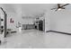 Expansive living room with tile flooring, open layout, and direct access to the kitchen at 491 Majestic Gardens Blvd, Winter Haven, FL 33880