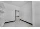 Walk-in closet with tile flooring and access to another room, featuring white shelves for storage at 491 Majestic Gardens Blvd, Winter Haven, FL 33880