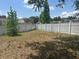 Backyard with a white fence, offering privacy and security at 5030 Silver Thistle Ln, St Cloud, FL 34772