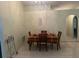 Dining area boasts tiled floors and a colorful tablecloth, creating a welcoming space to enjoy meals at 5030 Silver Thistle Ln, St Cloud, FL 34772